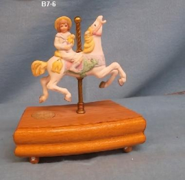 Girl On A Carousel Horse
